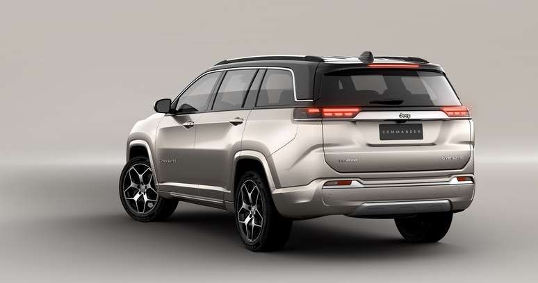 Rear view of a silver SUV with a modern design, featuring alloy wheels and a sleek profile.
