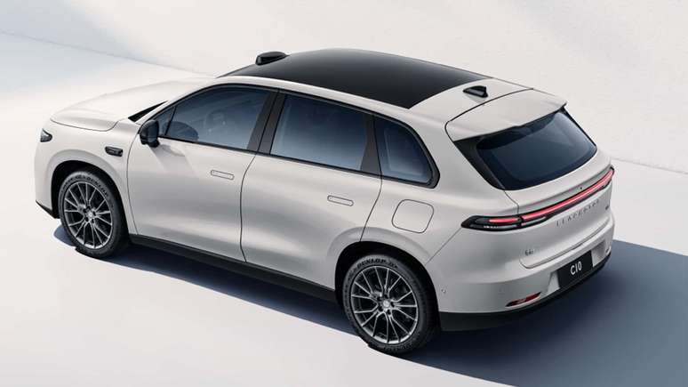 A modern white SUV with a sleek design, featuring a black roof and stylish alloy wheels, displayed from a rear angle.