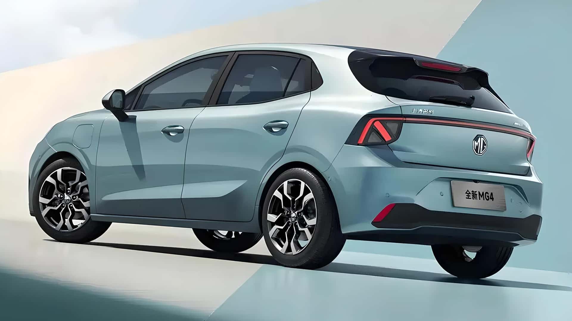 A sleek, modern hatchback car in light blue with stylish alloy wheels, viewed from the rear and side.