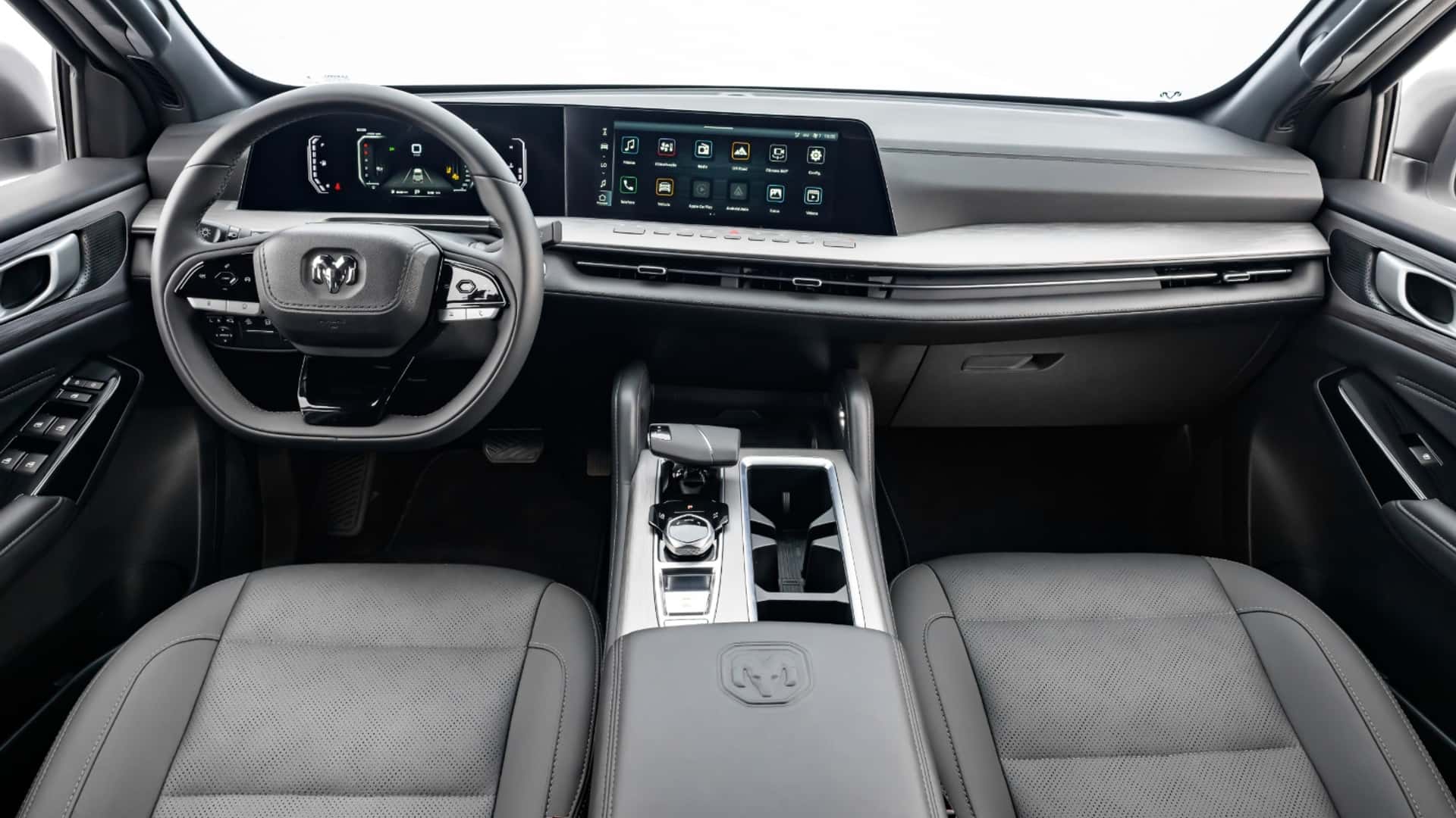 Interior view of a modern SUV featuring a sleek dashboard, a large central touchscreen display, and a multifunction steering wheel.