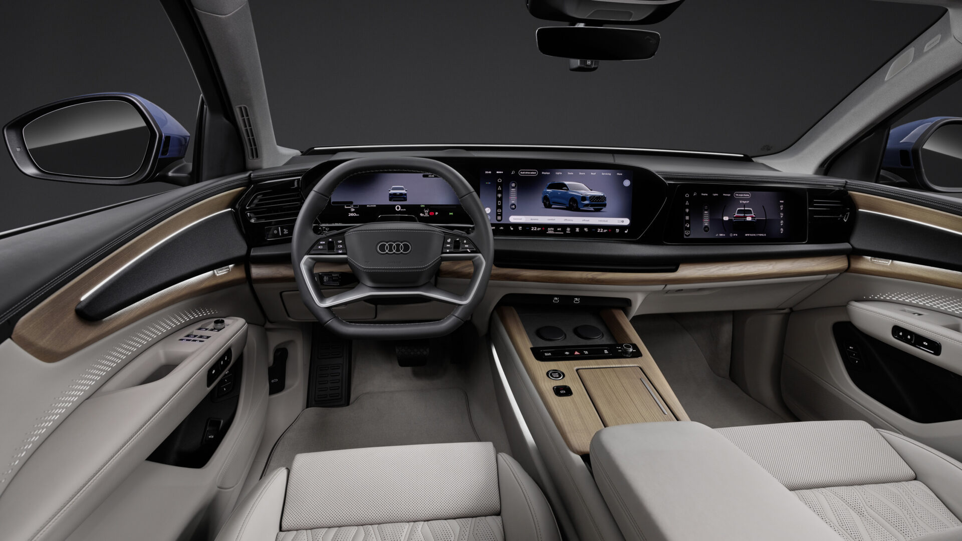 Interior view of an Audi vehicle showcasing a modern dashboard with dual digital displays, a stylish steering wheel, and premium leather seating.