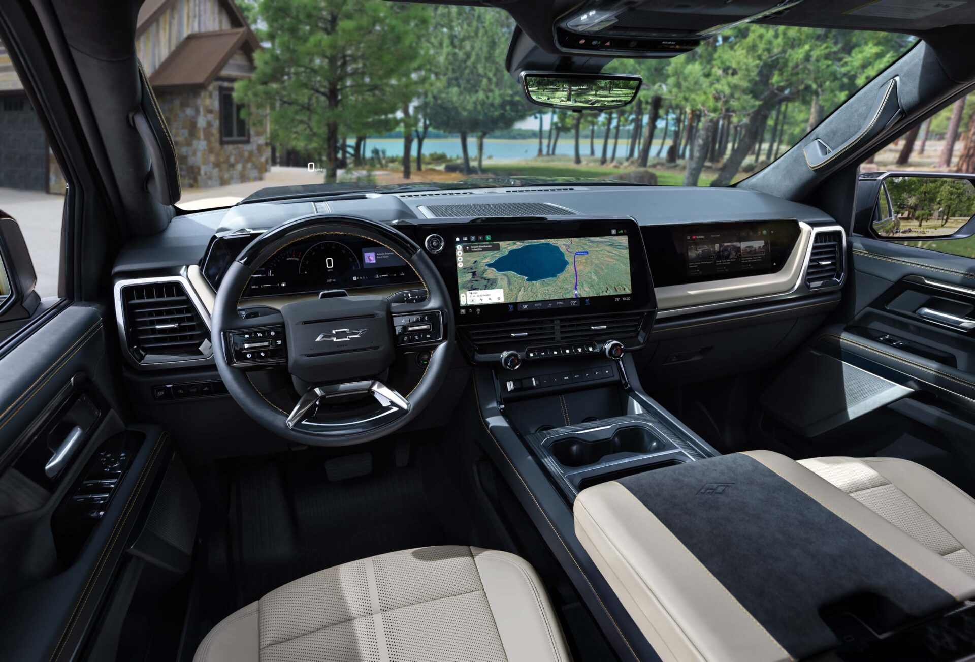 Interior view of a modern Chevrolet vehicle showing the dashboard, steering wheel, and touch screen display with navigation features.