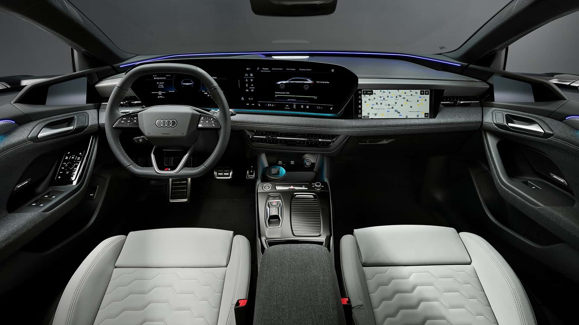 Interior view of a modern Audi car featuring a sleek dashboard, digital displays, and dual-tone leather seats.