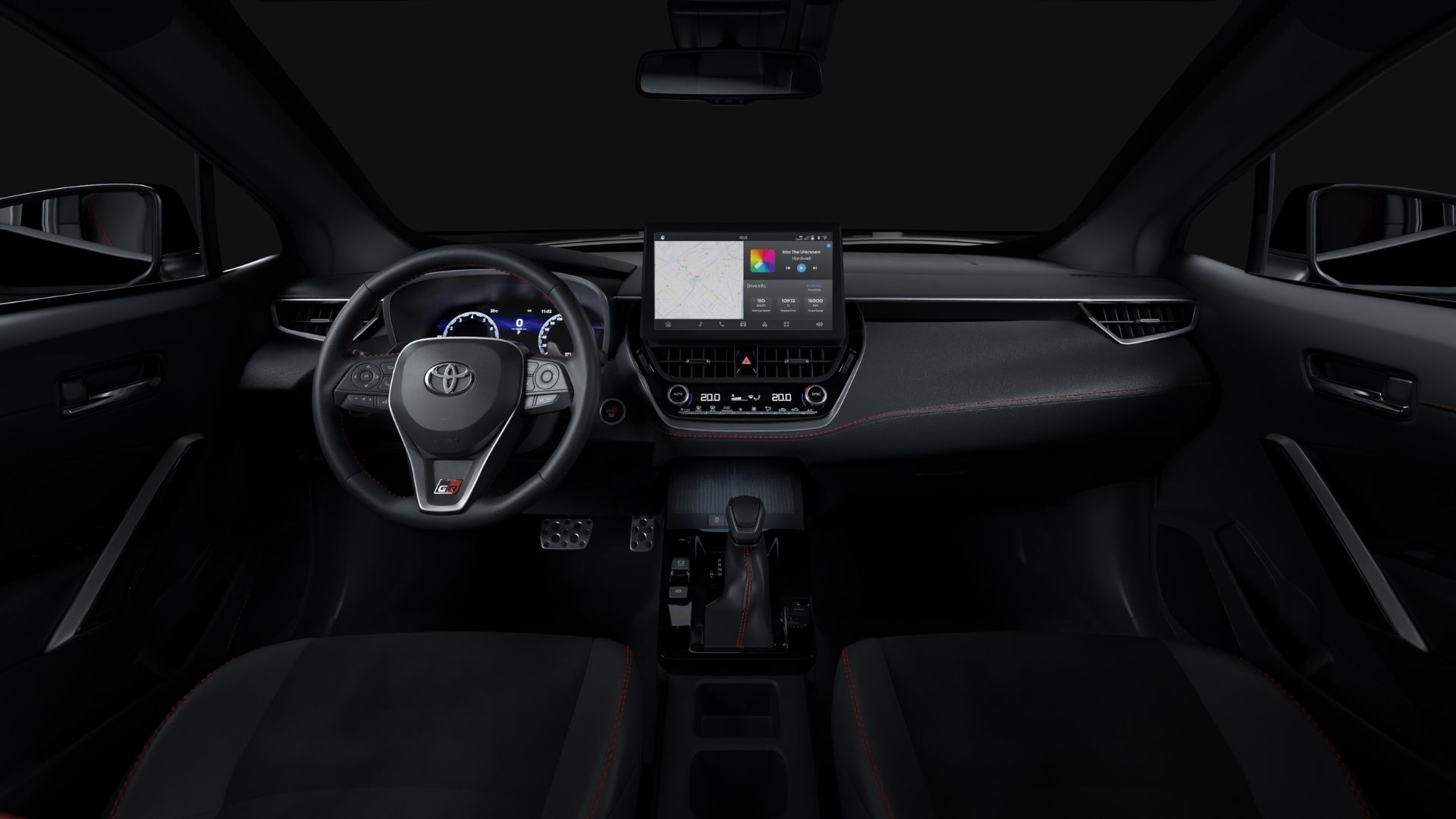 Interior view of a modern Toyota car showcasing the steering wheel, dashboard with infotainment system, and gear shift.