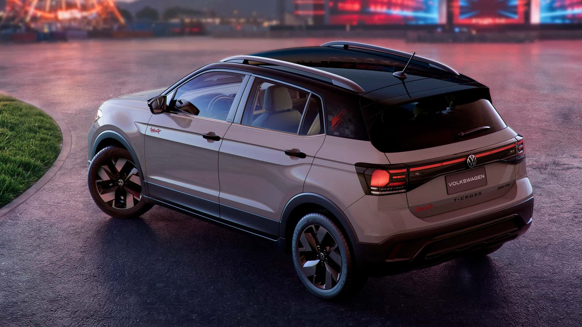 A Volkswagen T-Cross SUV parked on a smooth surface with a colorful background featuring lights, showcasing its sleek design and black accents.