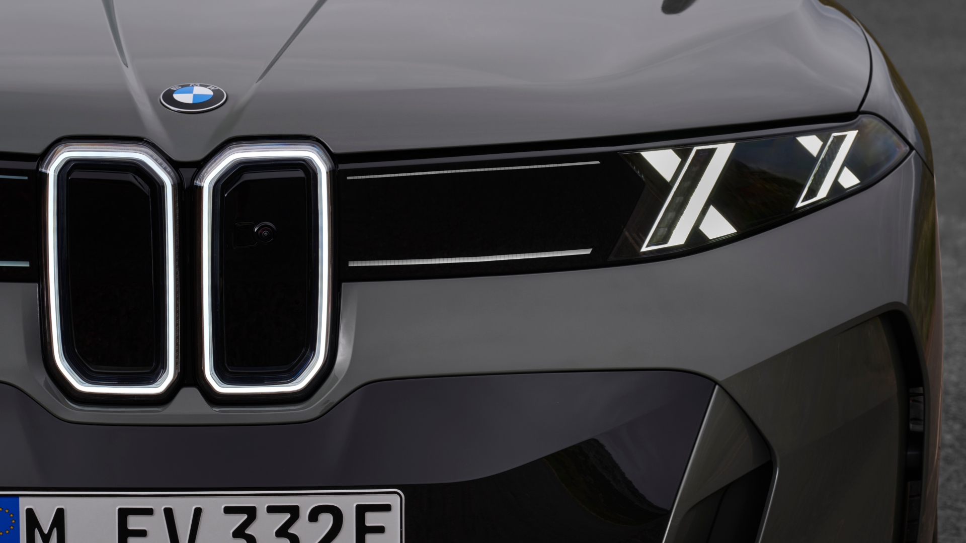Front view of a BMW car showcasing the iconic kidney grille and modern LED headlights.