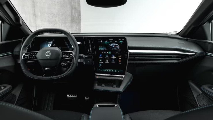 Interior view of a modern car featuring a sleek dashboard, multifunction steering wheel, and a large touch screen display.