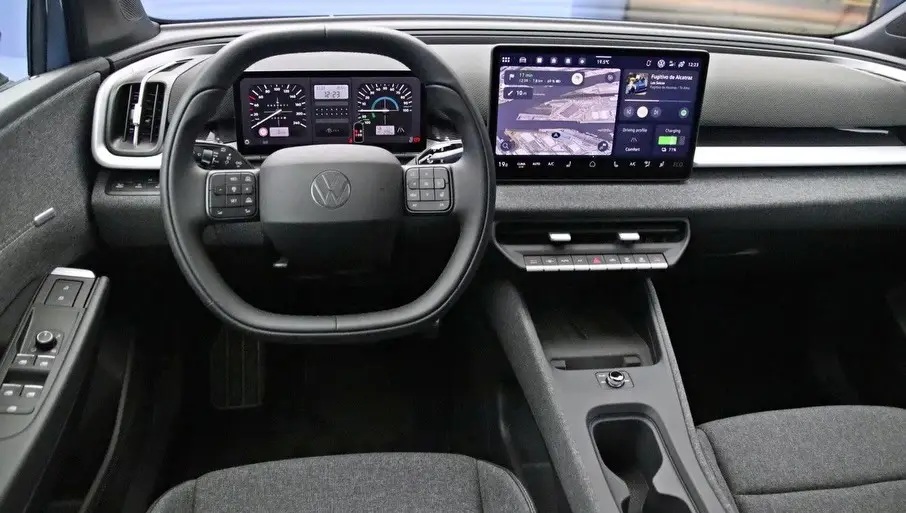 Interior view of a modern car dashboard showcasing a steering wheel, digital display, and control panel with a touchscreen interface.