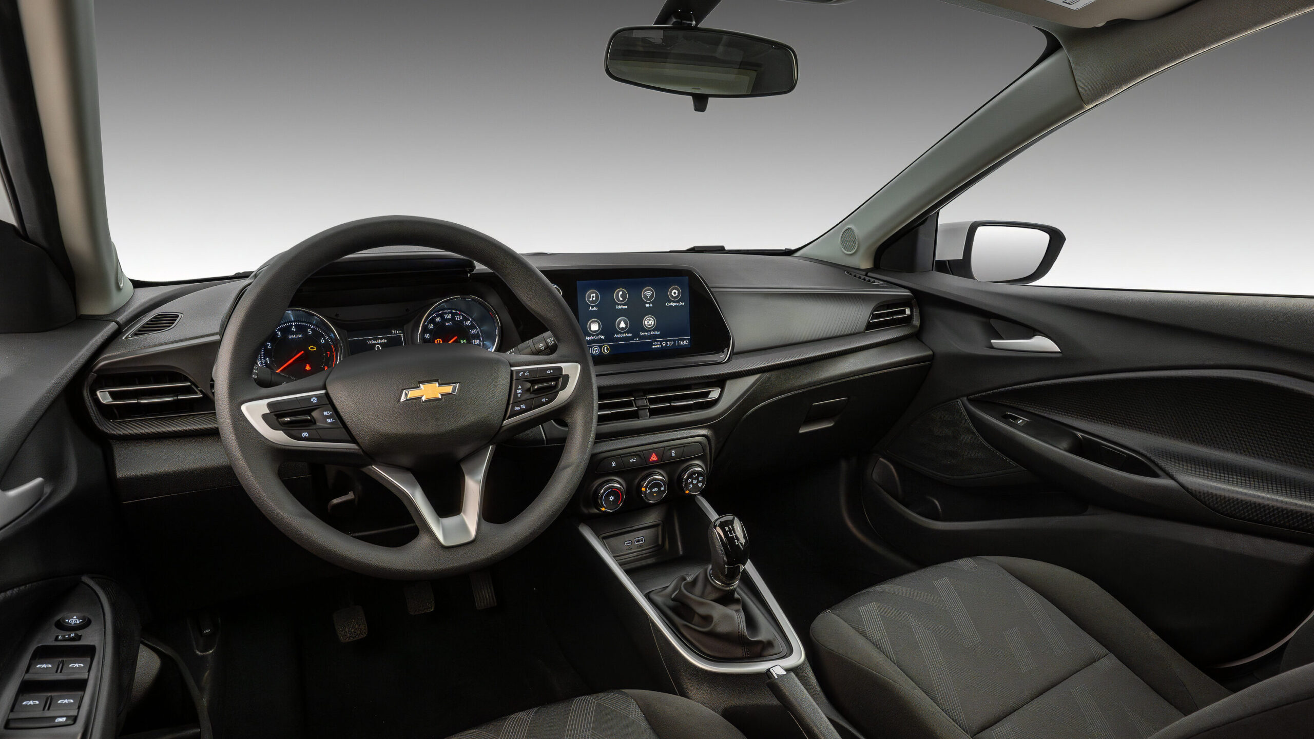 Interior view of a Chevrolet car featuring a modern dashboard, steering wheel, touchscreen display, and comfortable seating.