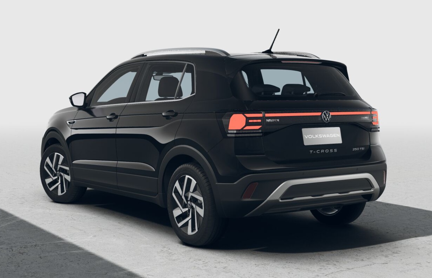 A black Volkswagen T-Cross SUV, showcasing its rear and side profile, set against a minimalistic background.