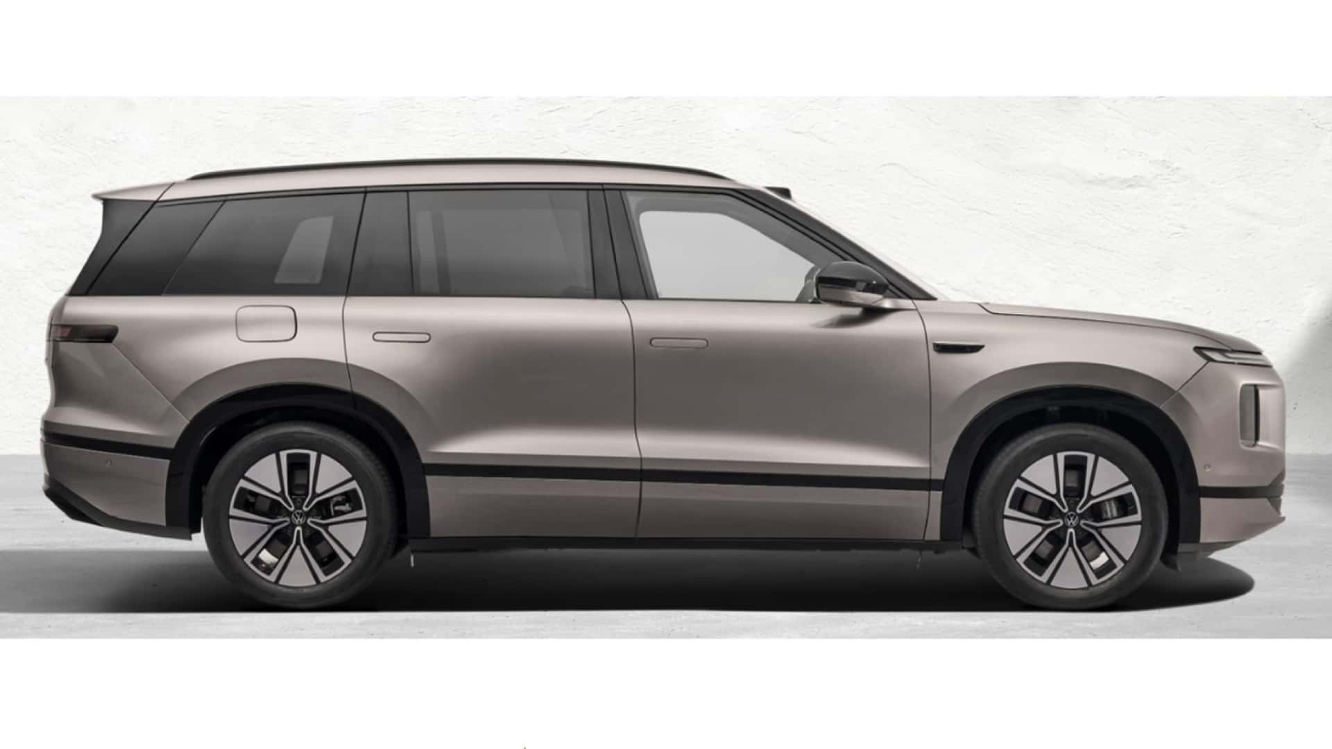 Side view of a modern SUV with a sleek design and distinctive features.